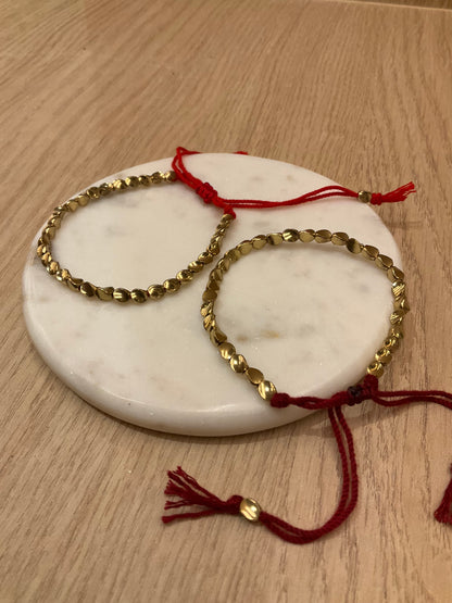 Copper Tibetan Bracelet with Red Thread – Protection, Energy, and Tradition
